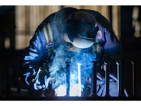 A worker welds steel at George Third & Son Steel Fabricators and Erectors, in Burnaby, B.C., on Thursday March 29, 2018. Statistics Canada says manufacturing sales fell 0.2 per cent in February to $56.6 billion, hurt by a retreat in the motor vehicle assembly and wood products industries.THE CANADIAN PRESS/Darryl Dyck