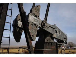 A pumpjack works at a well head on an oil and gas installation near Cremona, Alta., Saturday, Oct. 29, 2016. A report by AltaCorp Capital shows the number of companies still actively drilling in Canada has declined by 40 per cent since the oil price crash of late 2014.