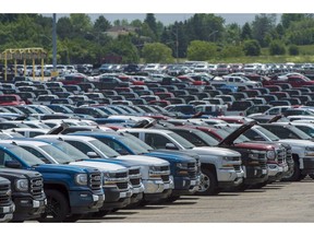 Vehicles are seen in a parking lot at the General Motors Oshawa Assembly Plant in Oshawa, Ont., on Wednesday, June 20, 2018. Statistics Canada says wholesale sales posted their third consecutive monthly gain as they increased 0.3 per cent to $63.7 billion in February.