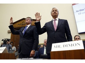 Citigroup CEO Michael Corbat, left, and JPMorgan Chase chairman and CEO Jamie Dimon are sworn in before testifying before the House Financial Services Committee during a hearing, Wednesday, April 10, 2019, on Capitol Hill in Washington.