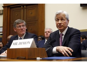 JPMorgan Chase chairman and CEO Jamie Dimon, right, testifies alongside Citigroup CEO Michael Corbat before the House Financial Services Commitee during a hearing, Wednesday, April 10, 2019, on Capitol Hill in Washington.