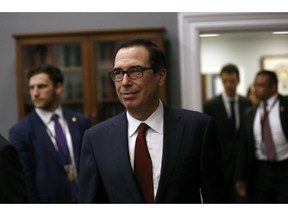 Treasury Secretary Steven Mnuchin arrives to testify before a House Appropriations subcommittee during a hearing on Capitol Hill, Tuesday, April 9, 2019, in Washington. Mnuchin said Tuesday that his department intends to "follow the law" and is reviewing a request by a top House Democrat to provide Trump's tax returns to lawmakers.