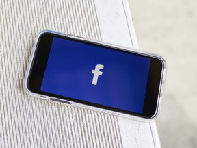 The Facebook logo on an iPhone screen