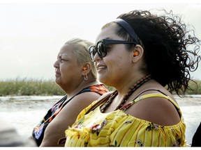 In this April 15, 2019 photo, Elina Llmas and her mother Miriam Llamas ride on an airboat tour through the Florida Everglades. Llamas said Visit Florida's campaigns inform potential visitors about largely unknown attractions outside of beaches and amusement parks. Visit Florida, the state's tourism agency, is caught in the middle of a funding dispute among lawmakers. Governor Ron DeSantis wants to continue to fully fund the agency, while the Senate wants to cut its budget by $45 million. Meanwhile, the house seeks to eliminate the agency altogether, funding it until October.