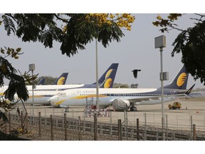 FILE- In this Monday, April 15, 2019 file photo, Jet Airways aircrafts are seen parked at Chhatrapati Shivaji Maharaj International Airport in Mumbai. Jet Airways, once India's largest airline, says it is temporarily suspending all operations after failing to raise enough money to run its services.
