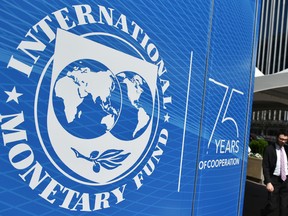 The seal of the International Monetary Fund (IMF) is seen outside of the headquarters building in Washington, DC.