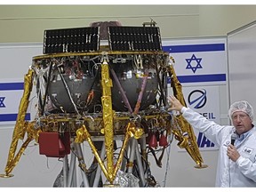 FILE - In this July 10, 2018 file photo, Opher Doron, general manager of Israel Aerospace Industries' space division, speaks beside the SpaceIL lunar module, during a press tour of their facility near Tel Aviv, Israel. On Thursday April 4, 2019, the first Israeli spacecraft to journey to the moon passed its most crucial test yet: dropping into lunar orbit one week ahead of landing.