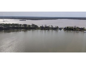 In this photo provided by the Mississippi Emergency Management Agency, homes in the Eagle Lake community of rural Warren County, Miss., are under siege from back flow waters as well as the lake, as seen in this image taken during a Wednesday, April 3, 2019 morning flyover by state and federal officials.