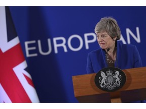 FILE - In this Thursday, April 11, 2019 file photo, British Prime Minister Theresa May speaks during a media conference at the conclusion of an EU summit in Brussels. May's Downing St. office says the prime minister and her husband Philip started a short walking holiday in Wales on Saturday, April 14. Parliament is on an Easter break, after months of bruising battles in Parliament over Brexit that saw May's European Union divorce deal rejected by lawmakers three times.