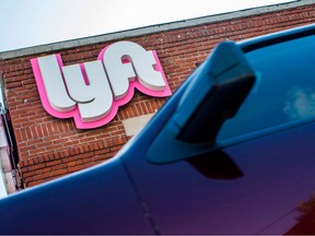 A driver rides his car in front of the Lyft drivers hub in Los Angeles, California.