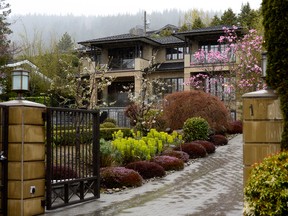 Rain falls outside a mansion for sale in West Vancouver.