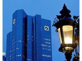 FILE-In this Feb. 1, 2019 file photo the Deutsche Bank headquarters is seen behind a lamp ahead of the annual press conference in Frankfurt, Germany. President Donald Trump has gone to court to fight an attempt by the House to obtain his business records. On Monday the president and three of his children filed suit in federal court in New York against Deutsche Bank and Capital One.