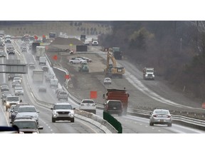 In a Friday, April 12, 2019 photo, Interstate Highway 75 construction continues in Troy, Mich. After passing waves of tax cuts in recent years, some Republican-dominated states have decided it's time to make a big exception, calling for tax increases to fix roads crumbling from years of low funding and deferred maintenance.