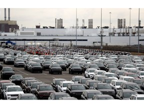 FILE- In this Feb. 26, 2019 file photo, Jeep vehicles are parked outside the Jefferson North Assembly Plant in Detroit. When Fiat Chrysler began considering where to build its next assembly plant, the automaker didn't have far to look for land. A short walk from its Jefferson North plant on Detroit's east side is 200 acres of land the company is eyeing as part of its $1.6 billion investment to convert an engine complex into a new facility. Decades of residential flight, disinvestment and abandonment have left the Motor City with stretches of available real estate which are appealing to some developers.