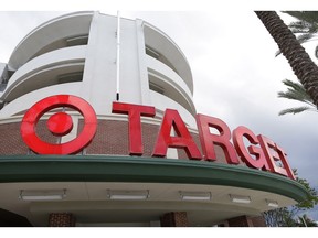 FILE - This Aug. 11, 2015 file photo shows a Target store in Miami.  Target is raising the minimum hourly wage for its workers for the third time in less than two years. The discounter said Thursday, April 4, 2019, it plans to raise the hourly starting wage to $13 from $12 in June.