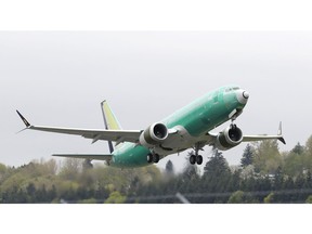 FILE - In this Wednesday, April 10, 2019 file photo, a Boeing 737 MAX 8 airplane being built for India-based Jet Airways, takes off on a test flight at Boeing Field in Seattle. A global team of experts next week will begin reviewing how the Boeing 737 Max's flight control system was approved by the U.S. Federal Aviation Administration. The FAA says experts from nine international civil aviation authorities have confirmed participation in a technical review promised by the agency.