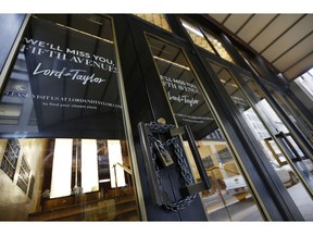 FILE - In this Jan. 2, 2019 file photo, a padlock secures a set of doors on a side entrance to Lord & Taylor's flagship Fifth Avenue store which closed for good in New York. A  key research firm says announced U.S. store closures this year are already exceeding the total for 2018. Coresight Research, which tracks store openings and closing, says retailers have announced 5,994 store closures and 2,641 store openings as of early April. That compares to 5,864 closures and 3,239 openings for the full year 2018.