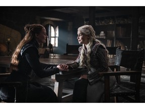 This image released by HBO shows Sophie Turner, left, Emilia Clarke in a scene from "Game of Thrones," that aired Sunday, April 21, 2019. With the Game of Thrones' Jon Snow revealing his royal lineage to his potential rival Daenerys Targaryen, the beleaguered army at Winterfell is about to find out if two chief executives better than one.