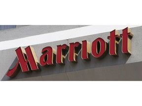 FILE - This March 23, 2016, file photo, shows a sign at a Marriott Hotel in Richmond, Va. Marriott is pushing more heavily into home-sharing, confident that its combination of luxury properties and loyalty points can lure travelers away from rivals like Airbnb.