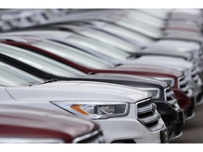 FILE- In this Sunday, Feb. 17, 2019, file photo, unsold 2019 Escape sports-utility vehicles sit in a long row at a Ford dealership in Broomfield, Colo. On Tuesday, April 2, the Commerce Department releases its February report on durable goods.