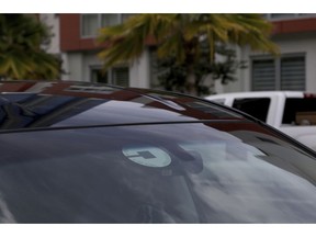 FILE- In this June 6, 2018, file photo Uber driver Joshua Oh drives in Honolulu. Uber launched a voucher program Tuesday, April 9, 2019, enabling companies like Westfield Mall and TGI Fridays to offer free or discounted Uber rides to customers.