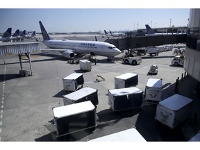FILE - In this July 18, 2018, file photo a United Airlines commercial jet sits at a gate at Terminal C of Newark Liberty International Airport in Newark, N.J. United Continental Holdings, Inc. reports financial results Tuesday, April 16, 2019.