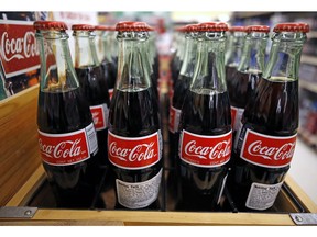 FILE - This Nov. 14, 2018, file photo shows Coca-Cola on display at a market in Pittsburgh. The Coca-Cola Co. reports financial results Tuesday, April 23, 2019.