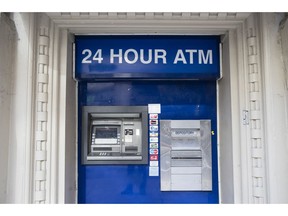 FILE - This Nov. 29, 2018, file photo shows an ATM in Philadelphia. It's important to find a bank that meets all your unique needs in terms of access, technology and cost. Be sure to consider credit unions or online banks that typically offer lower fees and better interest rates.