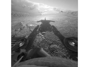 FILE - This July 26, 2004 file photo made available by NASA shows the shadow of the Mars Exploration Rover Opportunity as it traveled farther into Endurance Crater in the Meridiani Planum region of Mars. People took to social media this year to say goodbye to the Mars Opportunity rover when NASA lost contact on June 10, 2018, with the 15-year-old robot. (NASA/JPL-Caltech via AP, File)