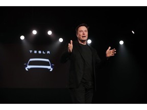 FILE- In this March 14, 2019, file photo Tesla CEO Elon Musk speaks before unveiling the Model Y at Tesla's design studio in Hawthorne, Calif.  A federal judge will hear oral arguments Thursday, April 4, about whether Tesla CEO Elon Musk should be held in contempt of court for violating an agreement with the U.S. Securities and Exchange Commission.