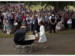 FILE - This July 5, 2015 file photo shows Britain's Prince William, Kate the Duchess of Cambridge, with son Prince George and daughter Princess Charlotte in a pram as they arrive for Charlotte's Christening at St. Mary Magdalene Church in Sandringham, England. Silver Cross, founded in 1877, has been bouncing royal babies in their fancy prams since the birth of King George VI. Prince Charles got around in one when he was born and now the three children of Prince William and the Duchess of Cambridge, Kate Middleton, have shared their Silver Cross ride.