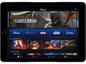 This image provided by Disney shows a product image of Disney Plus on a tablet. The video steaming service has been in the works for more than year, but Thursday, April 11, 2019, marked the first time that the longtime entertainment powerhouse has laid out plans for its attack on Netflix and a formidable cast of competitors, including Amazon, HBO Go and Showtime Anytime. (Disney via AP)