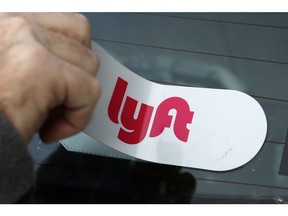 FILE - In this Jan. 31, 2018, file photo, a Lyft logo is installed on a Lyft driver's car in Pittsburgh. Lyft's stock fell 10 percent in trading Monday, April 1, 2019, just one day after the company went public.