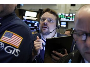 FILE - In this March 12, 2019, file photo, trader Michael Milano works on the floor of the New York Stock Exchange. The U.S. stock market opens at 9:30 a.m. EDT on Tuesday, April 23.