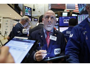 Trader Michael Urkonis works on the floor of the New York Stock Exchange, Tuesday, April 2, 2019. Stocks are opening lower on Wall Street as the market pulls back following a three-day rally.