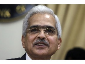 Reserve Bank of India Governor Shaktikanta Das smiles during a press conference to announce the first bi monthly monetary policy in Mumbai, India, Thursday, April 4, 2019. India's central bank has lowered its key interest rate by a quarter of a percentage point to 6% to strengthen domestic growth ahead of a national election next week.
