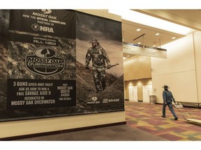 A poster hangs on the wall of the Indianapolis Convention Center on Thursday, April 25, 2019, where members of the National Rifle Association will be holding its 148th annual meetings in Indianapolis. The group's meetings come at a tumultuous time within the gun-rights organization.