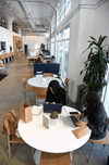 Merchants Samantha Romero, left, and Amanda Sin work on their businesses at Shopify Los Angeles. Part of Shopify’s business strategy is to challenge the prevailing mood that Amazon.com Inc. is the only future of retail by focusing on the little guys.