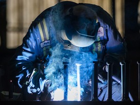 A worker welds steel at George Third & Son Steel Fabricators and Erectors, in Burnaby, B.C.