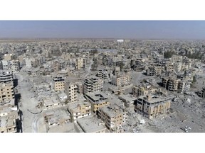 FILE - This Oct. 19, 2017 file photo, a frame grab made from drone video shows damaged buildings in Raqqa, Syria. Amnesty International and Airwars, a London-based watchdog group, said Thursday, April 25, 2019, that the U.S.-led coalition killed more than 1,600 civilians in the northern Syria city of Raqqa during months of bombardment that liberated it from the Islamic State group. They said the toll came after the "most comprehensive investigation into civilian deaths in a modern conflict."