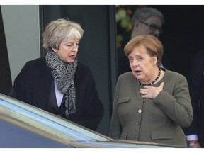 German Chancellor Angela Merkel, right, and British Prime Minister Theresa May leave after their meeting at the chancellery in Berlin, Germany, Tuesday, April 9, 2019.