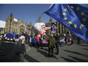 Anti-Brexit demonstrators near College Green at the Houses of Parliament in London, Monday, April 1, 2019.  Britain's Parliament gets another chance Monday to offer a way forward on Britain's stalled divorce from the European Union, holding a series of votes on Brexit alternatives in an attempt to find the elusive idea that can command a majority.