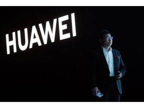 FILE - In this March 26, 2019, file photo, Huawei CEO Richard Yu stands during the presentation of the new Huawei P30 smartphone, in Paris. Chinese tech giant Huawei said Monday, April 22, 2019, its revenue rose 39 percent over a year earlier in the latest quarter despite U.S. pressure on allies to shun its telecom and network technology as a security risk.