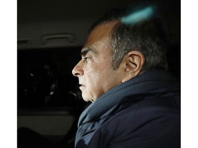In this April 3, 2019 photo, former Nissan Chairman Carlos Ghosn in a car leaves his lawyer's office in Tokyo. Japanese prosecutors took Ghosn for questioning Thursday, April 4, 2019, barely a month after he was released on bail ahead of his trial on financial misconduct charges.