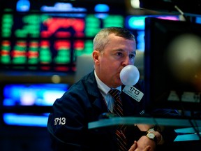 A trader makes a bubble with a chewing gum ahead of the closing bell on the floor of the New York Stock Exchange (NYSE) on January 29, 2019 in New York City.