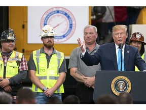 President Donald Trump speaks in front of pipeline workers at the International Union of Operating Engineers International Training and Education Center Wednesday, April 10, 2019, in Crosby, Texas.
