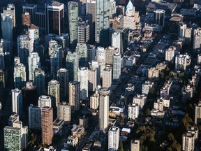 Commercial and residential buildings stand in this aerial photograph taken above Vancouver, British Columbia.
