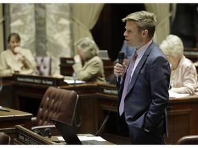In this Jan. 30, 2019 photo, Sen. Jamie Pedersen, D-Seattle, speaks on the Senate floor at the Capitol in Olympia, Wash. Pedersen is the primary sponsor of a bill that has Washington poised to become the first state in the U.S. to allow a human burial alternative known as "natural organic reduction," an accelerated process of decomposition that turns a body into soil in a matter of weeks. The bill legalizing the process, sometimes referred to as human composting, has passed key votes in both the Senate and the House and awaits a final vote in the Senate.