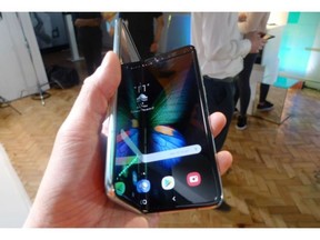 The Samsung Galaxy Fold smartphone is seen during a media preview event in London, Tuesday April 16, 2019. Journalists who received the phones to review before the public launch say the Galaxy Fold screen started flickering and turning black before completely fizzling out.