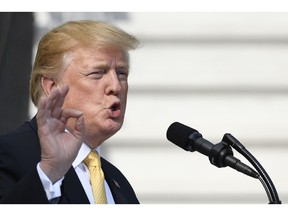 In this April 25, 2019, photo, President Donald Trump speaks on the South Lawn of the White House in Washington.